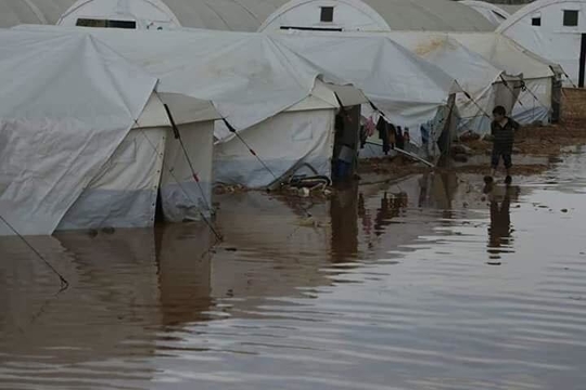 Picture of boy in flooded camp
